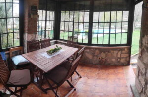 Porche entrada acristalado